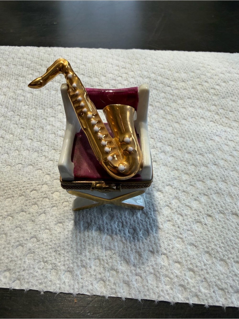 Limoge saxophone on chair
